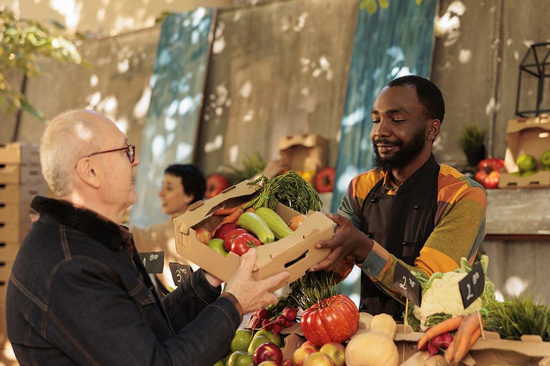 People selling veggies at farmer's market