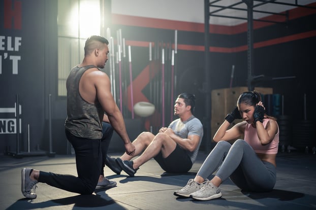 Personal trainer working with clients