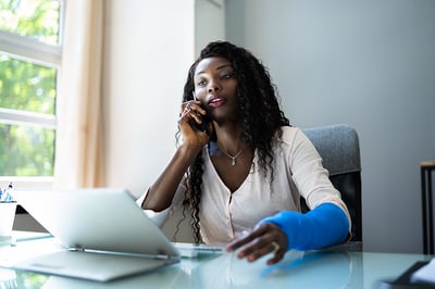 Worker with broken arm in cast