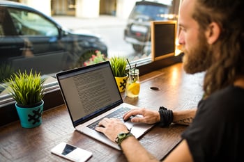 freelance writer works on laptop
