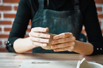 woman making pottery