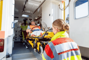 EMT putting a person in an ambulance 