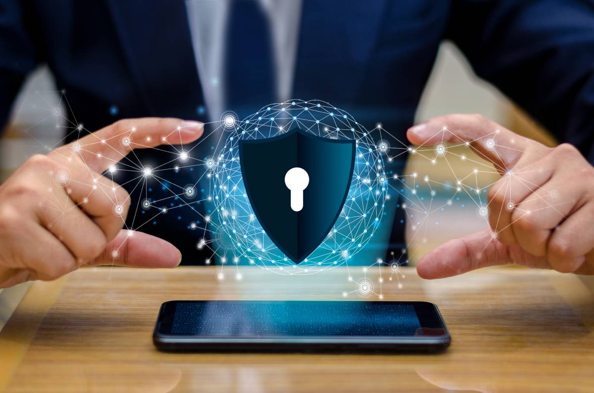 Businessman over mobile phone with representation of cyber security on mobile
